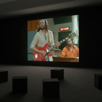 Installation view of Stan Douglas, Luanda-Kinshasa, 2013. Single-channel video projection, 6 hr. 1 min. (loop), color, sound