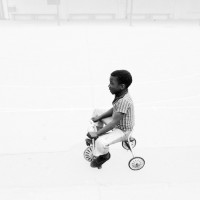 Boy tricycle© Dennis Morris