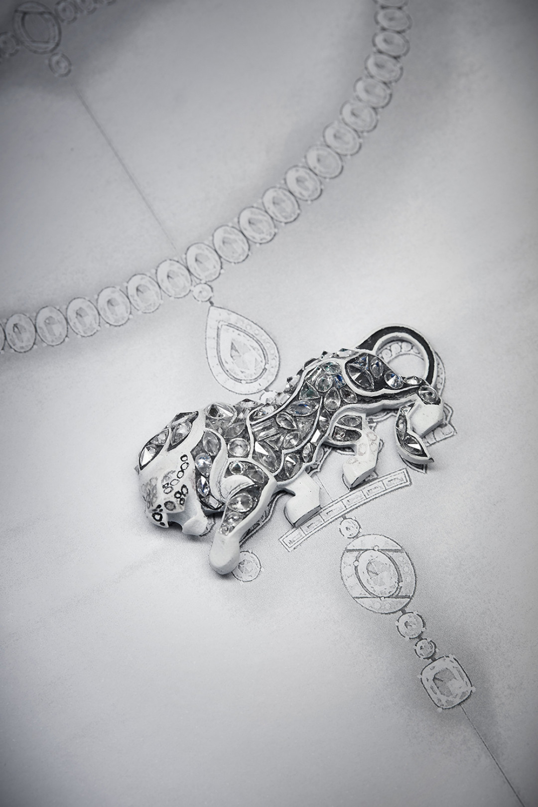 Work on the pieces from the L'ESPRIT DU LION High Jewelry collection in the CHANEL workshop, 18 Place Vendôme, Paris - View of the body of the lion with all of the shaped diamonds.