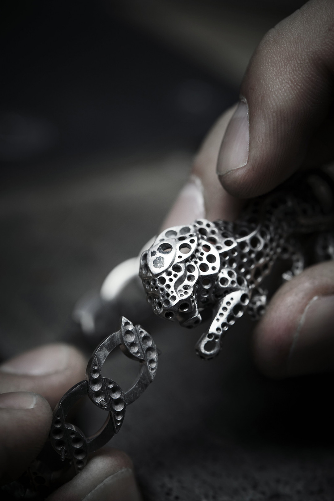 Work on the pieces from the L'ESPRIT DU LION High Jewelry collection in the CHANEL workshop, 18 Place Vendôme, Paris - Assembling of the watch's different elements before setting.